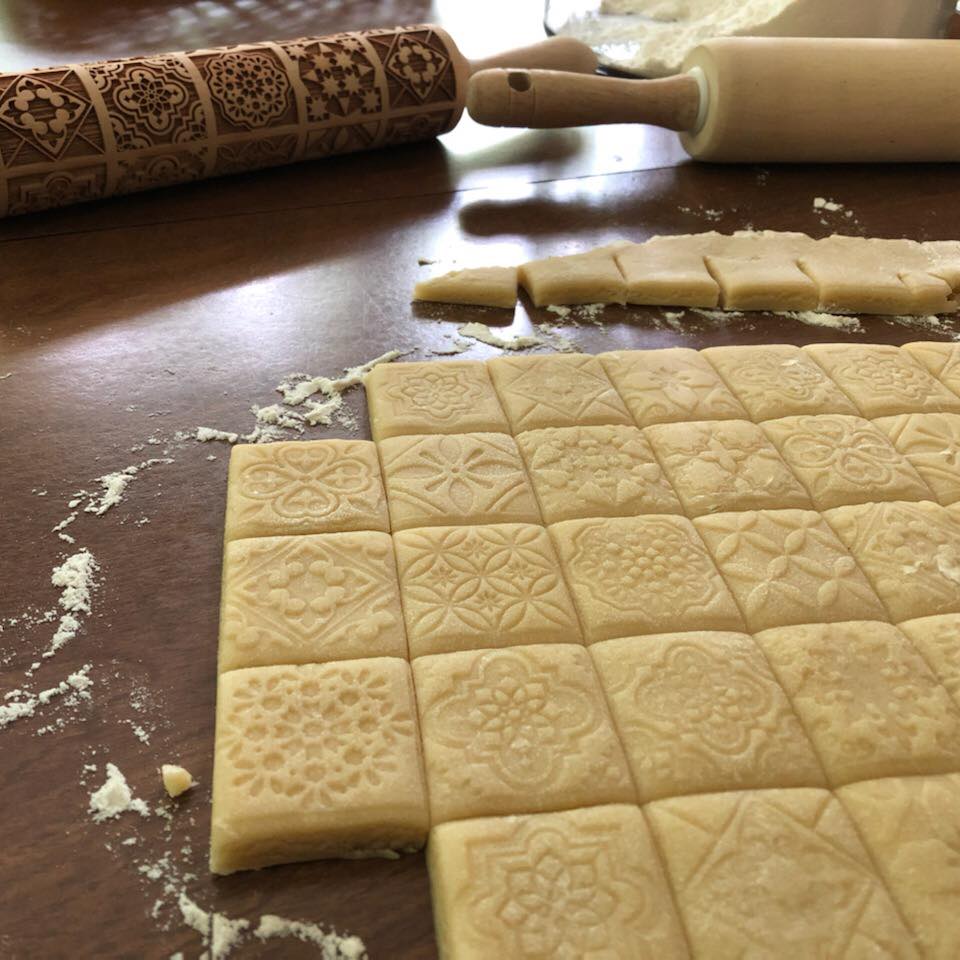 Anise cookies rolled out and cut into squares.