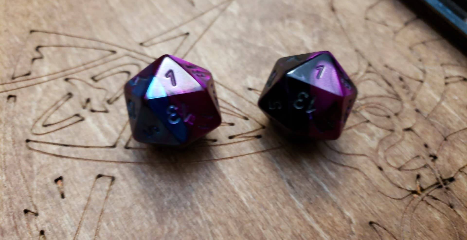 Deep purple twenty sided gaming dice that have both rolled a 1.