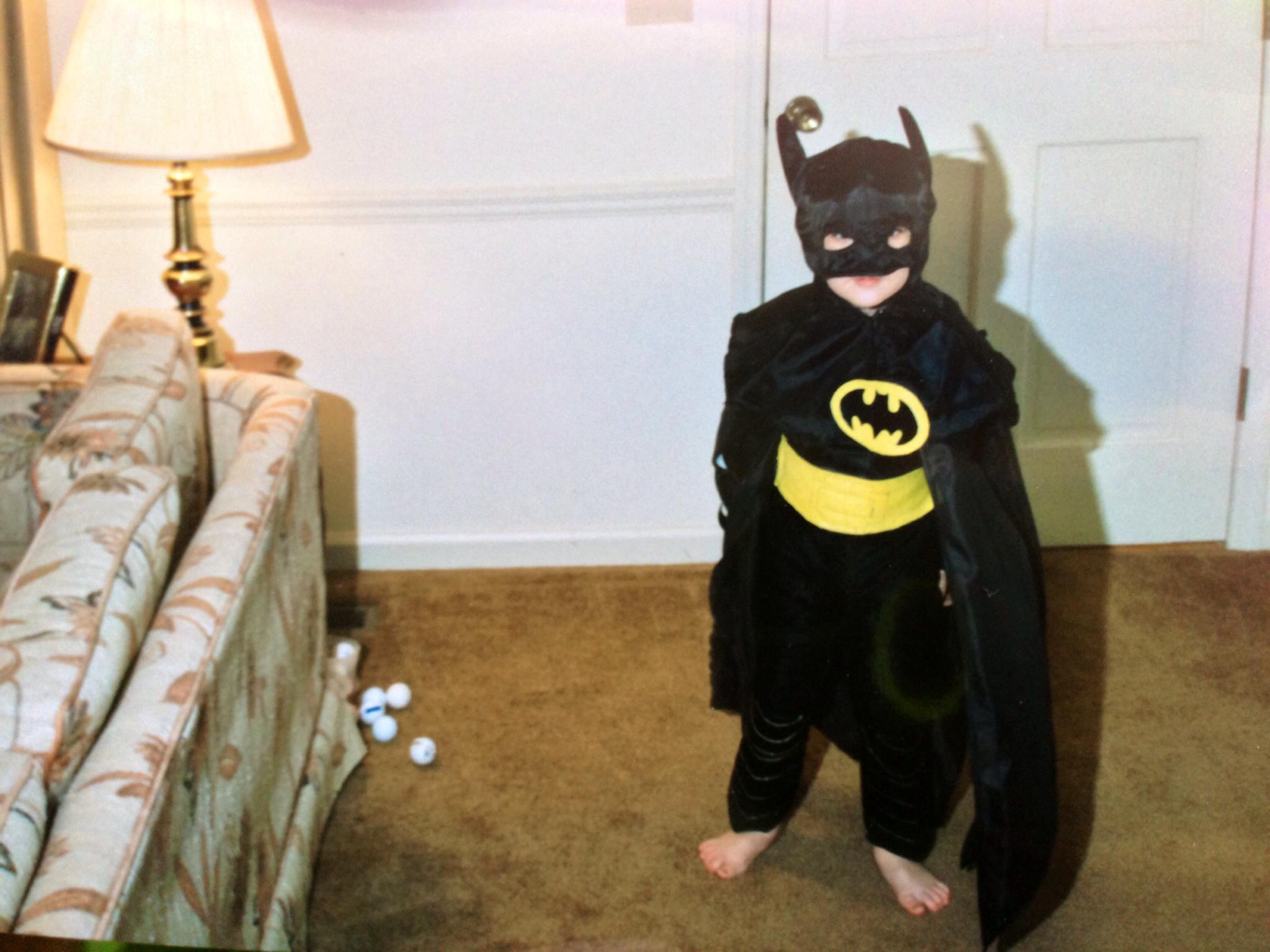 Young boy dressed up in homemade batman costume for Halloween