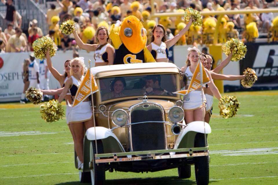 Georgia Tech's Mascot, the Rambling Wreck with cheerleaders and Buzz.
